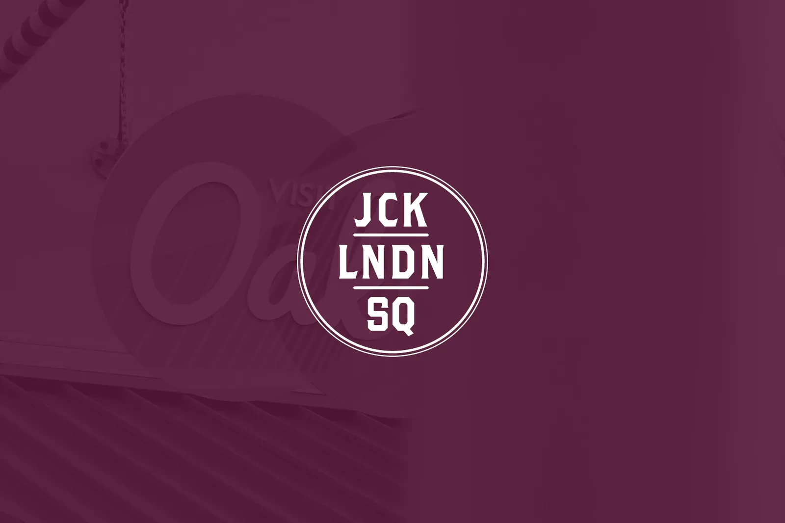 The JCK LNDN SQ monogram on the campaign maroon