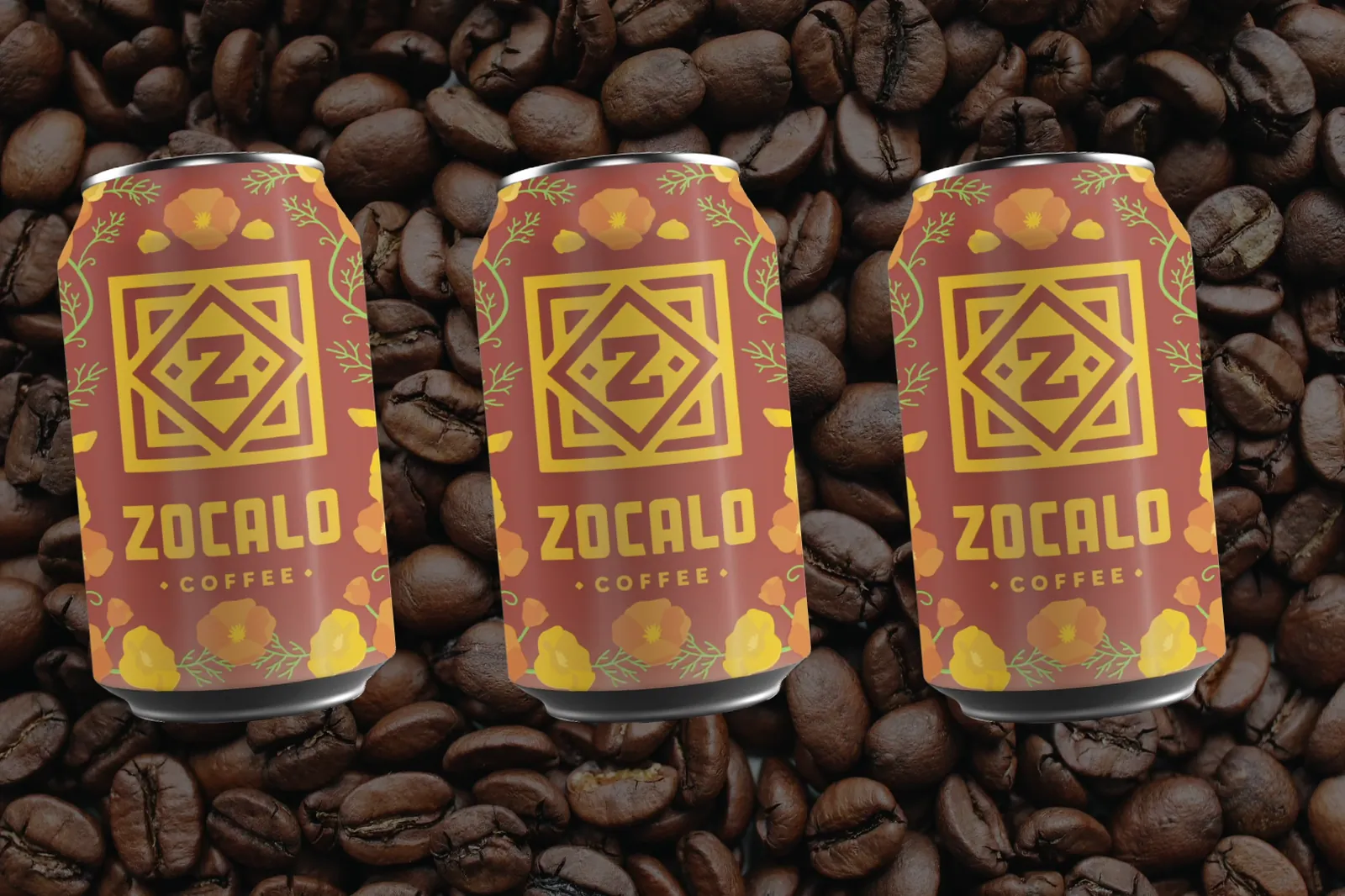 Three Zocalo Coffee cans on a bed of coffee beans